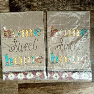 Two new “home sweet home” tea towels